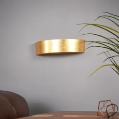 Jasin - vegglampe med gullfarget overflate
