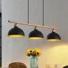 Lindby hengelampe Tirzana, 3 lyskilder, svart, metall, tre