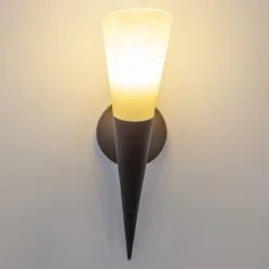 Lindby-vegglampe Alva, rustfarget, glass, 34 cm høy, E14